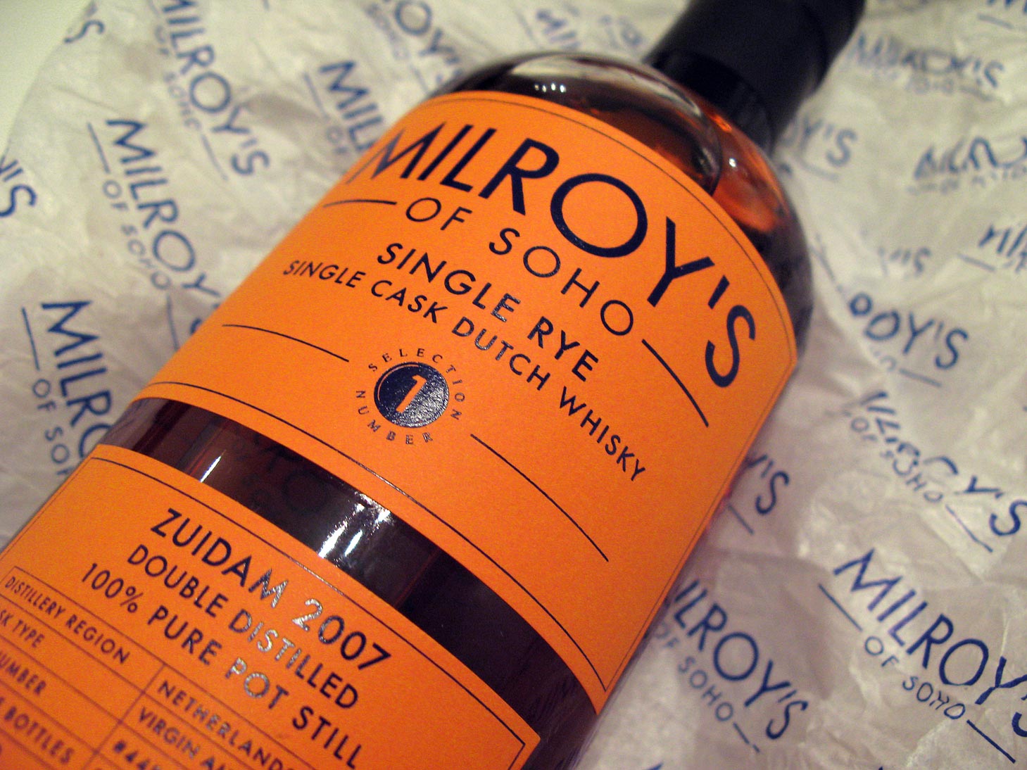 Milroy's simple, but striking label is a drinks cabinet winner. Mandarin and Imperial Blue. Winner